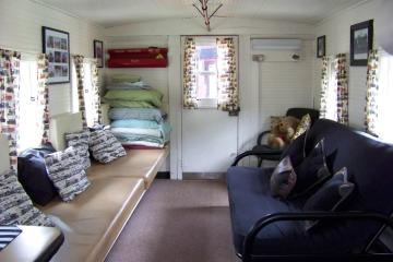 a living room filled with furniture and a flat screen tv